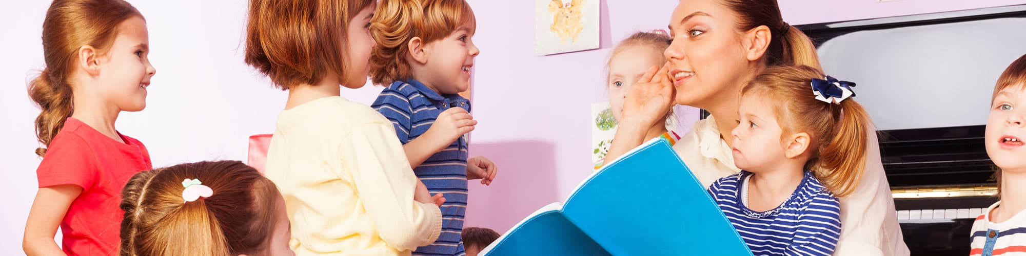 Woman reading to children